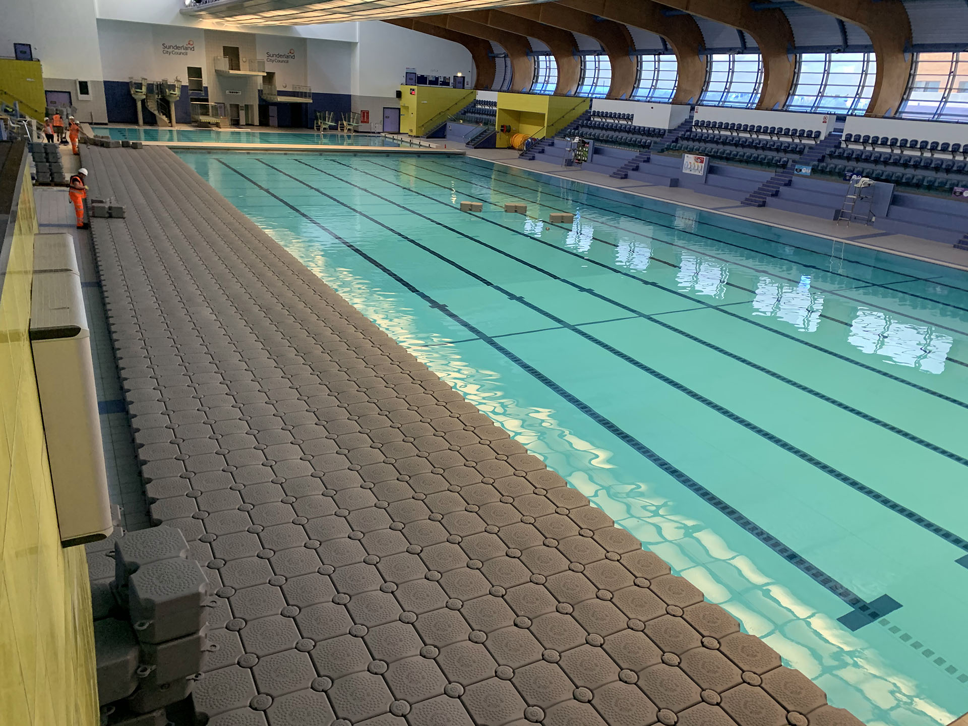 floating platform along swimming pool indoors